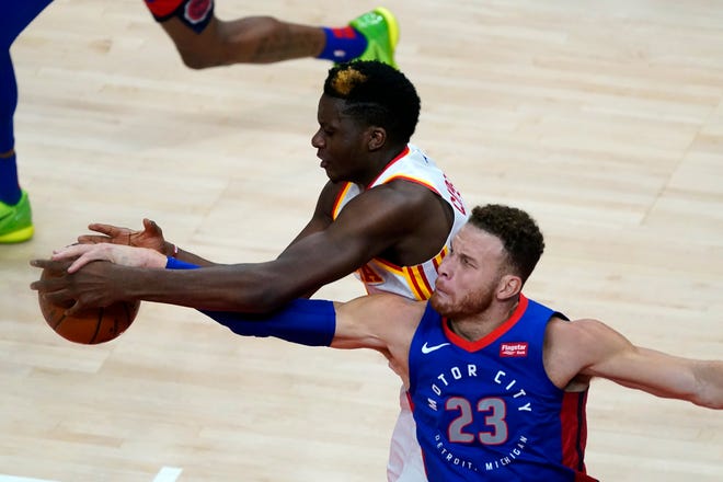 Detroit Pistons forward Blake Griffin (23) and Atlanta Hawks center Clint Capela vie for control of the ball during the second half of an NBA basketball game Wednesday, Jan. 20, 2021, in Atlanta.