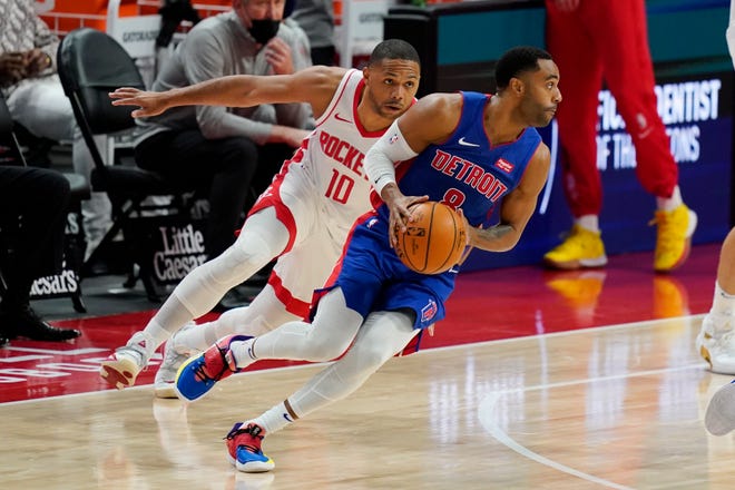 Detroit Pistons guard Wayne Ellington (8) controls the ball as Houston Rockets guard Eric Gordon (10) defends during the second half of an NBA basketball game, Friday, Jan. 22, 2021, in Detroit.