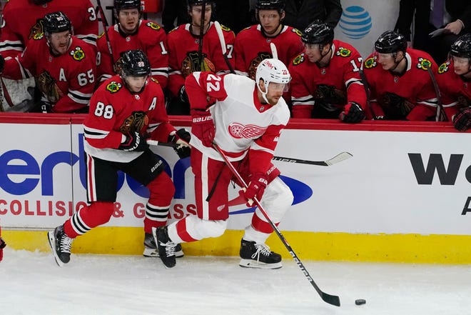 Detroit Red Wings left wing Patrik Nemeth, right, controls the puck past Chicago Blackhawks right wing Patrick Kane during the first period.