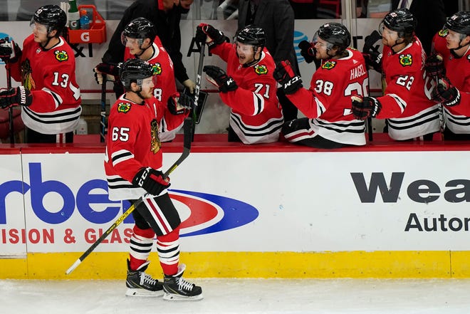 Chicago Blackhawks right wing Andrew Shaw (65) celebrates with teammates after scoring a goal during the third period.