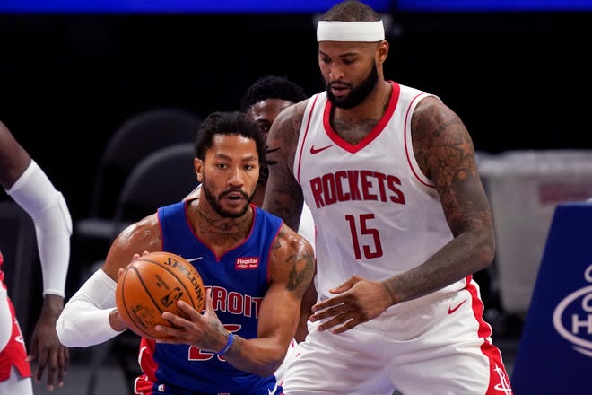 Detroit Pistons guard Derrick Rose (25) looks to pass as Houston Rockets center DeMarcus Cousins (15) defends during the second half of an NBA basketball game, Friday, Jan. 22, 2021, in Detroit.