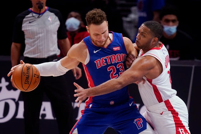 Detroit Pistons forward Blake Griffin (23) is defended by Houston Rockets guard Eric Gordon during the second half of an NBA basketball game, Friday, Jan. 22, 2021, in Detroit.