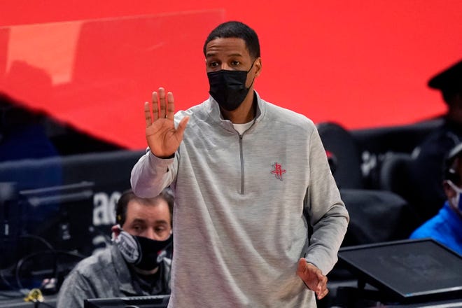 Houston Rockets head coach Stephen Silas signals from the sideline during the first half.