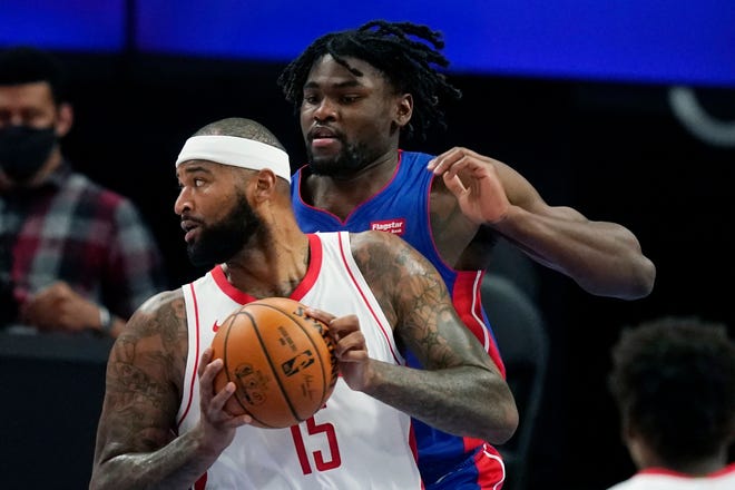 Houston Rockets center DeMarcus Cousins (15) looks to pass as Detroit Pistons center Isaiah Stewart (28) defends during the first half.