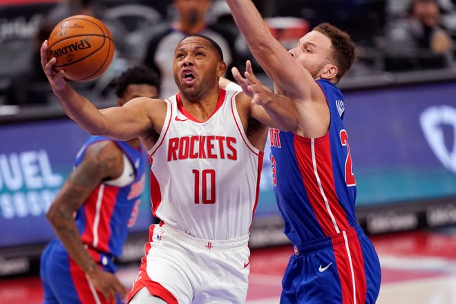 Houston Rockets guard Eric Gordon (10) attempts a layup as Detroit Pistons forward Blake Griffin defends during the second half of an NBA basketball game, Friday, Jan. 22, 2021, in Detroit.