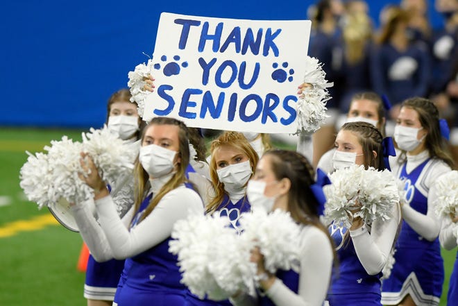 The Grand Rapids Catholic Central cheer team thank the seniors on their football team as they played against Frankenmuth in the fourth quarter of a Division 5 football final held at Ford Field.