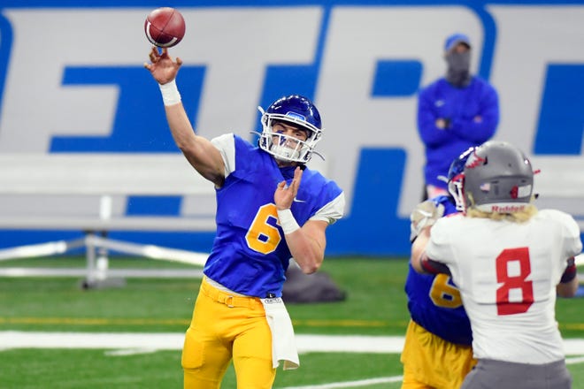 Grand Rapids Catholic Central quarterback Joey Silveri passes against Frankenmuth in the first half of a Division 5 football final held at Ford Field.