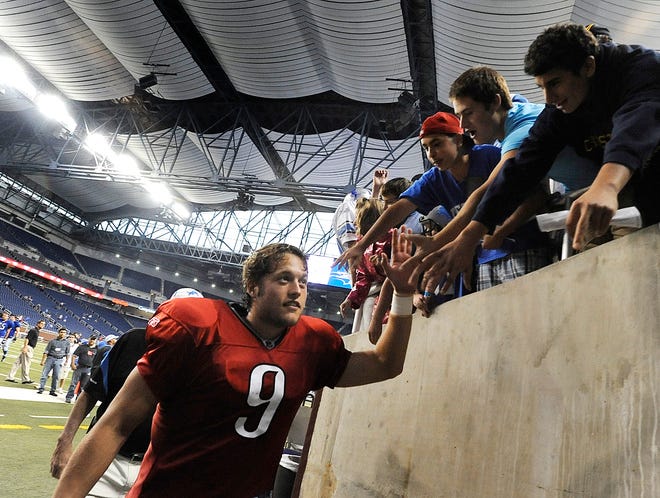 Lions quarterback Matthew Stafford leaves the field after training camp practice at Ford Field  in Allen Detroit,   Michigan on August 8, 2009.