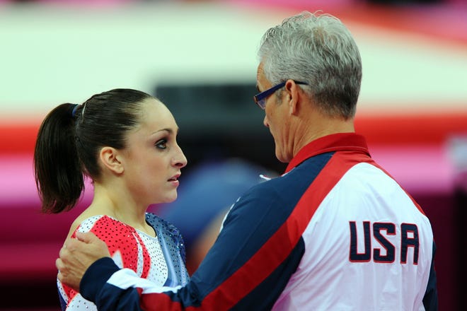 LONDON, ENGLAND - AUGUST 07:  Jordyn Wieber of the United States of America reacts with her coach John Geddert after competing in the Artistic Gymnastics Women's Floor Exercise final on Day 11 of the London 2012 Olympic Games at North Greenwich Arena on August 7, 2012 in London, England.