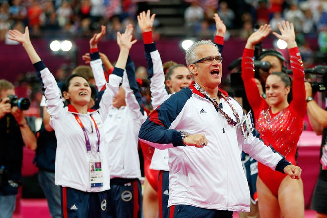 United States women's gymnastics coach John Geddert celebrates during the final rotation in the Artistic Gymnastics Women's Team final on Day 4 of the London 2012 Olympic Games at North Greenwich Arena on July 31, 2012 in London, England.