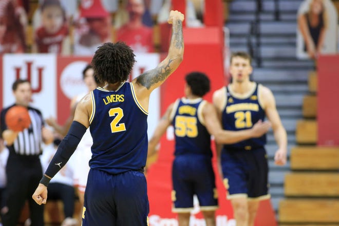 Michigan's Isaiah Livers (2) celebrates after a made basket by Franz Wagner against Indiana.