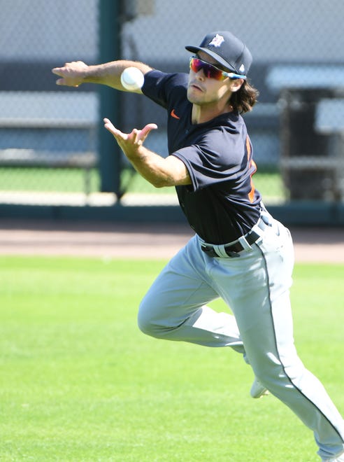 Tigers non-roster invitee Jacob Robson makes a barehanded catch during drills at the Detroit Tigers workout at Joker Marchant Stadium in Lakeland, Fla. on Feb. 27, 2021.