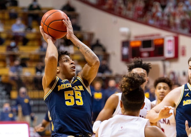 Michigan guard Eli Brooks (55) takes a shot during the first half.
