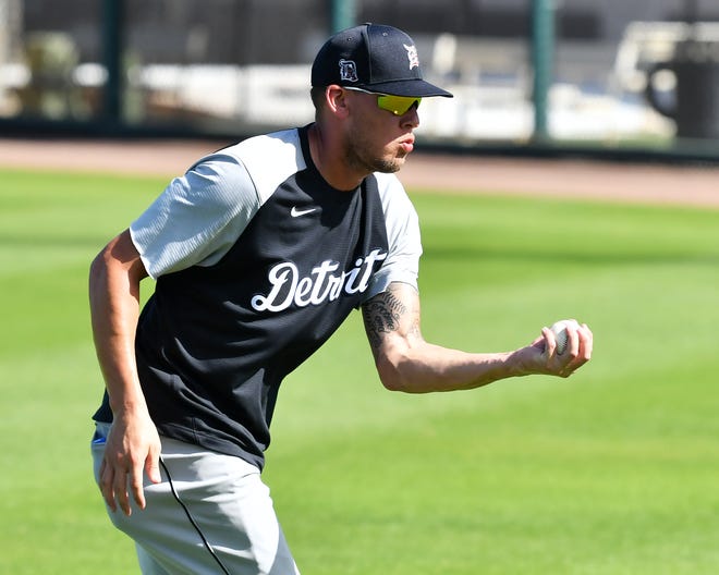 Tigers outfielder JaCoby Jones makes a barehanded catch during drills at the Detroit Tigers workout at Joker Marchant Stadium in Lakeland, Fla. on Feb. 27, 2021.