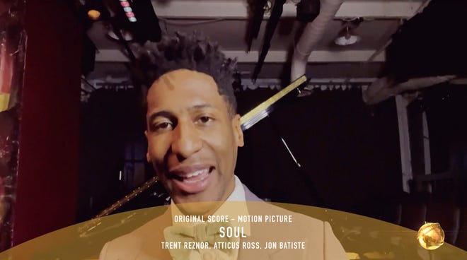 In this video grab issued Sunday, Feb. 28, 2021, by NBC, Jon Batiste accepts the award for best original score in a motion picture for "Soul" at the Golden Globe Awards.