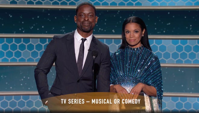 In this video grab issued Sunday, Feb. 28, 2021, by NBC, Sterling K. Brown, left, and Susan Kelechi Watson present the award for best television series, musical or comedy, at the Golden Globe Awards.