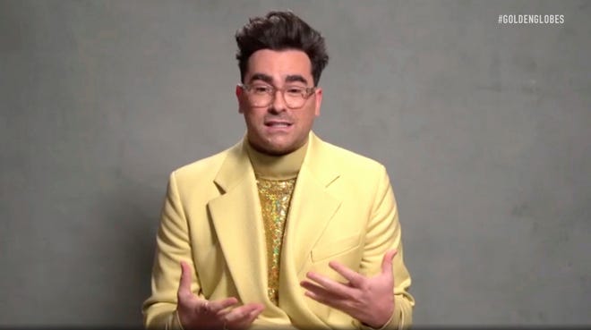 In this video grab issued Sunday, Feb. 28, 2021, by NBC, Daniel Levy accepts the award for best television series, musical or comedy, for "Schitt's Creek" at the Golden Globe Awards.