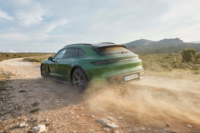 Go on, take it off road. The 2021 Porsche Taycan Cross Turismo adds one inch of ride height over the Taycan and Gravel drive mode.