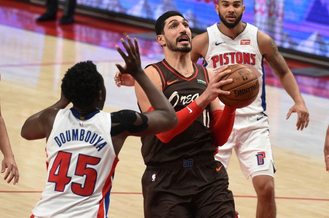Portland Trail Blazers center Enes Kanter drives to the basket on Detroit Pistons forward Sekou Doumbouya, left, during the second half.