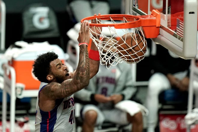 Detroit Pistons' Saddiq Bey makes a dunk against the Los Angeles Clippers during the first half of an NBA basketball game Sunday, April 11, 2021, in Los Angeles.