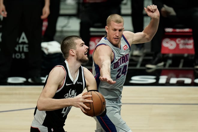Los Angeles Clippers' Ivica Zubac, left, is pressured by Detroit Pistons' Mason Plumlee during the second half.