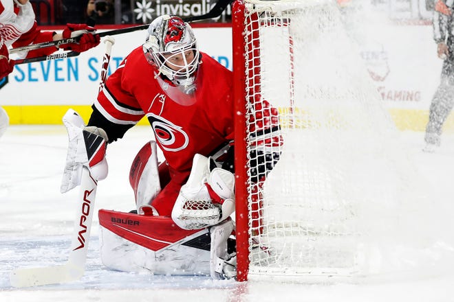 Carolina Hurricanes goaltender James Reimer (47) eyes the puck against the Detroit Red Wings during the first period.
