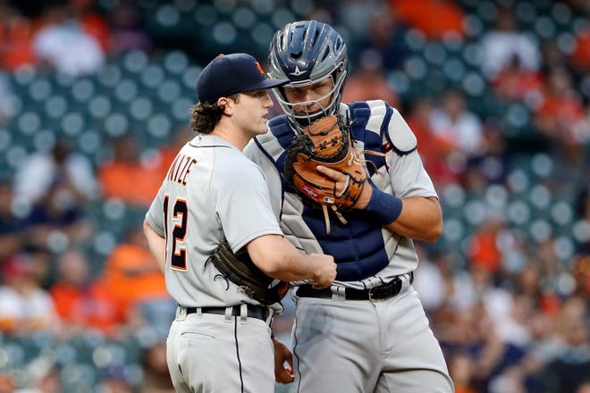 Detroit Tigers starting pitcher Casey Mize, left, and catcher Grayson Greiner, right, confer on the mound during the first inning of a baseball game against the Houston Astros Monday, April 12, 2021, in Houston.