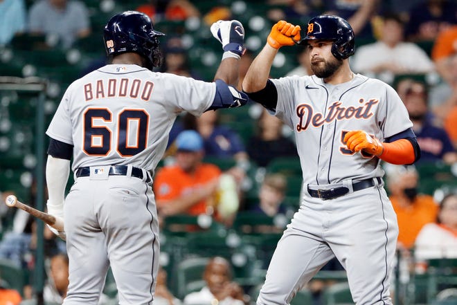 Detroit Tigers' Akil Baddoo, left, and Renato Nunez, right, celebrate Nunez's home run during the third inning of a baseball game against the Houston Astros Monday, April 12, 2021, in Houston. Baddoo hit a homer for back-to-back home runs.