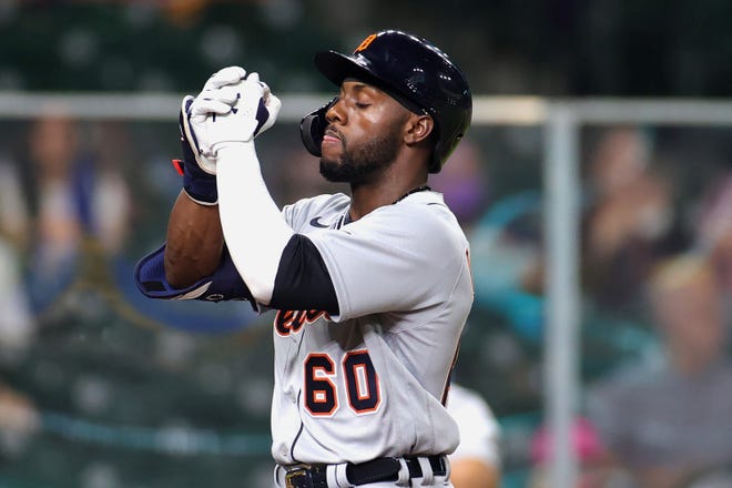 Akil Baddoo #60 of the Detroit Tigers reacts as he crosses home plate after hitting  a solo home run during the third inning against the Houston Astros at Minute Maid Park on April 13, 2021 in Houston, Texas.