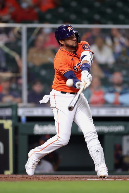 Yuli Gurriel #10 of the Houston Astros singles to right field during the second inning against the Detroit Tigers at Minute Maid Park on April 13, 2021 in Houston, Texas.