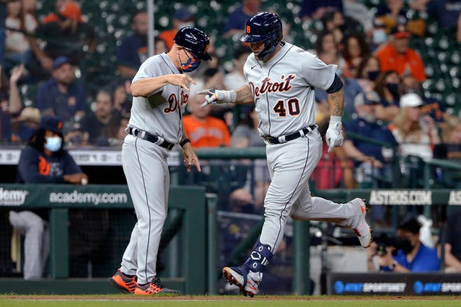 Detroit Tigers third base coach Chip Hale, left, celebrates with Wilson Ramos (40), who had hit a two-run home run against the Houston Astros during the fifth inning of a baseball game Tuesday, April 13, 2021, in Houston.