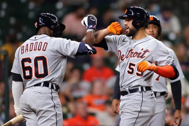 Renato Nunez #55 of the Detroit Tigers celebrates with Akil Baddoo #60 after hitting a home run during the fourth inning against the Houston Astros at Minute Maid Park on April 13, 2021 in Houston, Texas.