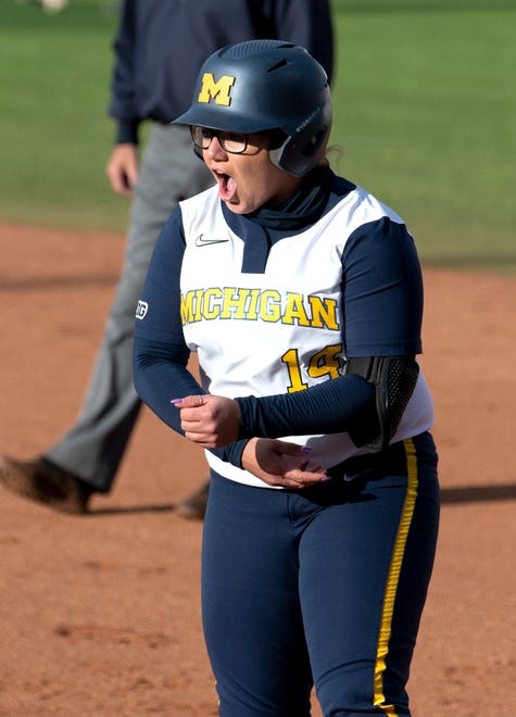 Michigan's Lou Allan celebrates at first base after hitting an RBI single in the fifth inning.