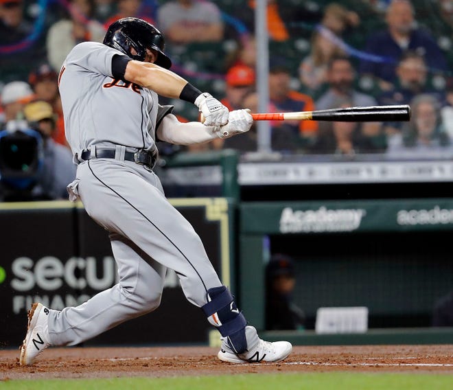 Robbie Grossman #8 of the Detroit Tigers hits a RBI single in the second inning against the Houston Astros at Minute Maid Park on April 14, 2021 in Houston, Texas.