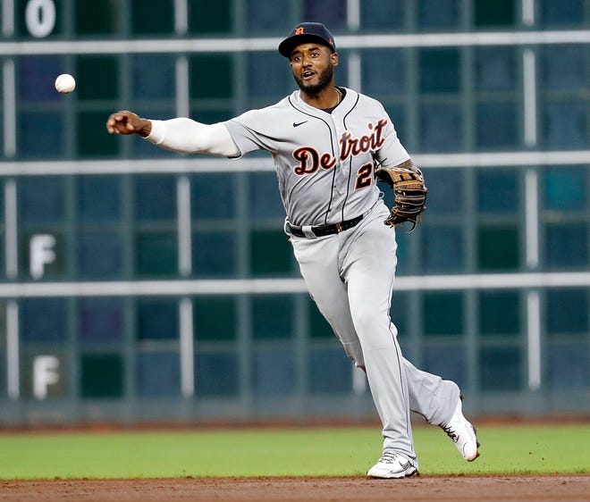 Niko Goodrum #28 of the Detroit Tigers throws out Myles Straw #3 of the Houston Astros during their game at Minute Maid Park on April 14, 2021 in Houston, Texas.
