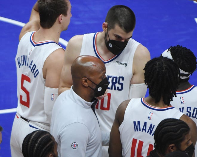 Former Pistons' "Mr. Big Shot" now a member of the Clippers coaching staff, works with the players late in the game.