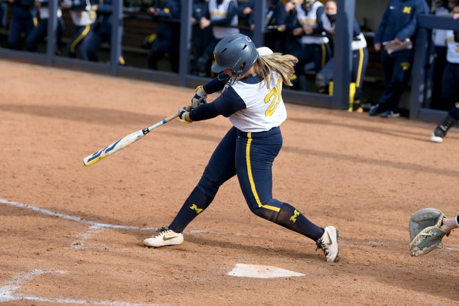 Michigan's Hannah Carson hits an RBI double in the fourth inning against Michigan State.