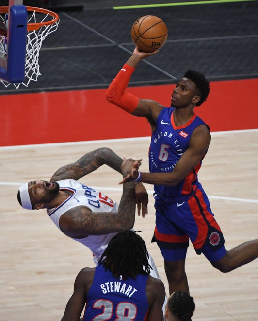 Clippers' DeMarcus Cousins takes the hit by Pitsons' Hamidou Diallo, who is called for the offensive foul, in the fourth quarter.