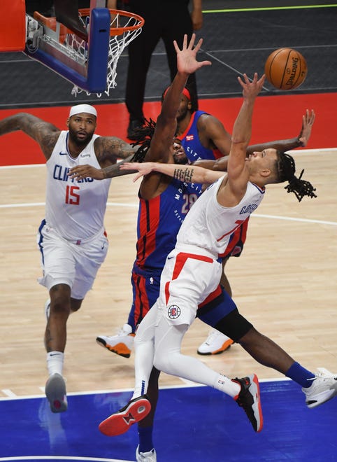 Clippers' Amir Coffey loses the ball driving to the basket n the first quarter.