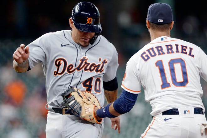 Detroit Tigers' Wilson Ramos (40) is tagged on a pickle play by Houston Astros first baseman Yuli Gurriel (10) during the third inning of a baseball game Wednesday, April 14, 2021, in Houston.