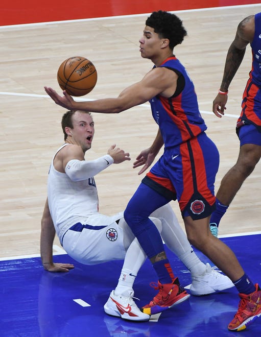 Former Piston, Clippers' Luke Kennard reacts after getting taken to the floor by Pistons' Killian Hayes in the second quarter.
