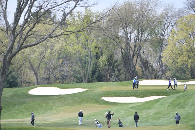 High School golfers participate at a jamboree on the north course of Oakland Hills Country Club in Bloomfield Hills, Michigan on April 26, 2021.