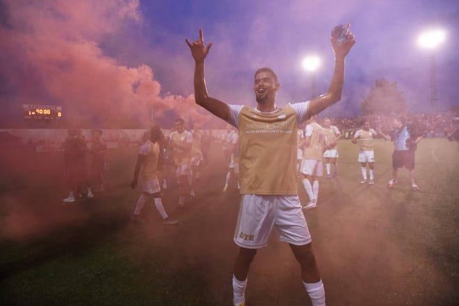 Detroit City FC's Javan Torre celebtrates with fans as he comes out of the smoke,Saturday, July 3, 2021 during the NISA Championship held at Keyworth Stadium in Hamtramck. Detroit defeated L.A. 1-0.
