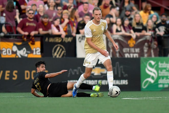 Detroit City FC defenseman Matt Lewis, right, takes the ball away from L.A. Force midfielder Diego Barrera in the second half, Saturday, July 3, 2021 during the NISA Championship held at Keyworth Stadium in Hamtramck.  Detroit defeated L.A. 1-0.