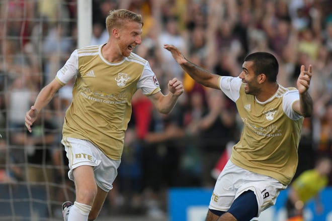Detroit City FC forwards Connor Rutz, left, and Patricio Botello celebrate after the L.A. Force scored on themselves in the second half, Saturday, July 3, 2021 during the NISA Championship held at Keyworth Stadium in Hamtramck.  Detroit defeated L.A. 1-0.