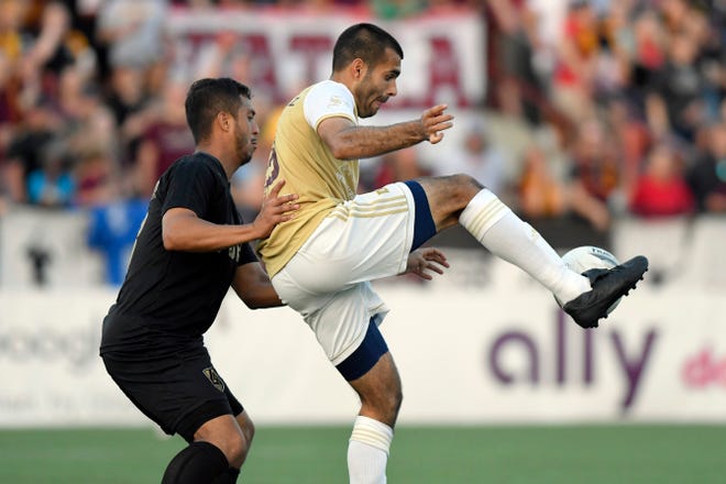 Detroit City FC forward Patricio Botello, right, catches a pass against the L.A. Force in the second half, Saturday, July 3, 2021 during the NISA Championship held at Keyworth Stadium in Hamtramck.  Detroit defeated L.A. 1-0.