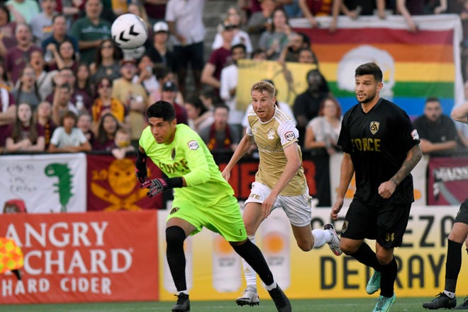 Detroit City FC forward Connor Rutz, middle, and L.A. Force''s Hugo Gomez, left, and Alex Culwell watch as a passed ball by L.A. goes into the net during the second half, Saturday, July 3, 2021 during the NISA Championship held at Keyworth Stadium in Hamtramck.  Detroit defeated L.A. 1-0.