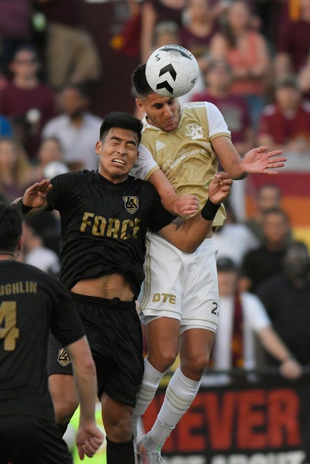 Detroit City FC defenseman Kevin Venegas, right, fights for the ball against an L.A. Force defender in the second half, Saturday, July 3, 2021 during the NISA Championship held at Keyworth Stadium in Hamtramck.  Detroit defeated L.A. 1-0.
