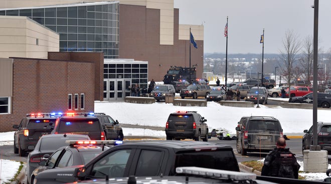 Police, fire and EMS personnel respond at Oxford High School on Tuesday, Nov. 30, 2021, after reports of an active shooter.
