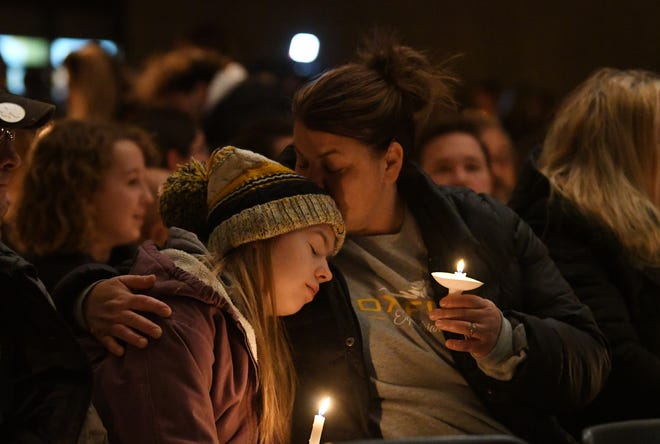 Oxford High School student Deedee Hernandez, 15, and mother Meghan Hernandez during the candlelight vigil at Lake Point Community Church in Oxford on Tuesday, Nov. 30, 2021.